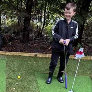 Families United playing golf at The Puddle Project